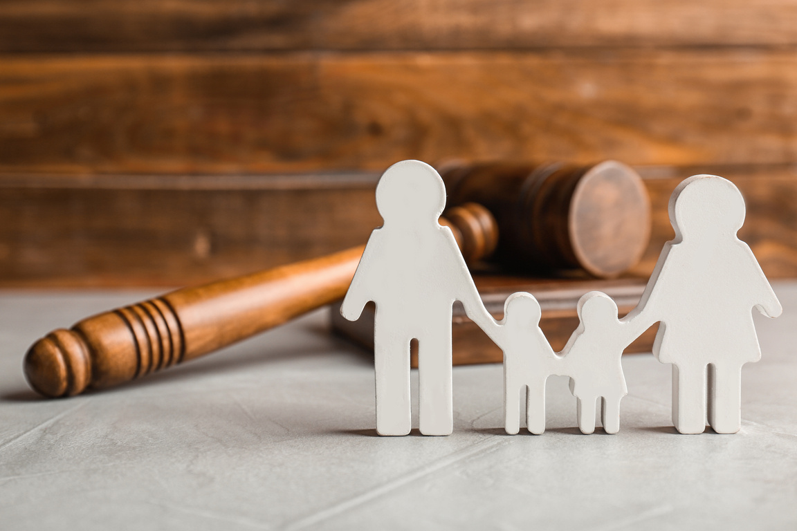 Family Figure and Gavel on Table. Family Law Concept